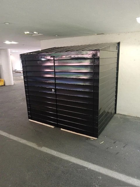 Steel Masters NYC crew delivering a custom cellar door installation for a Bushwick Brooklyn property owner