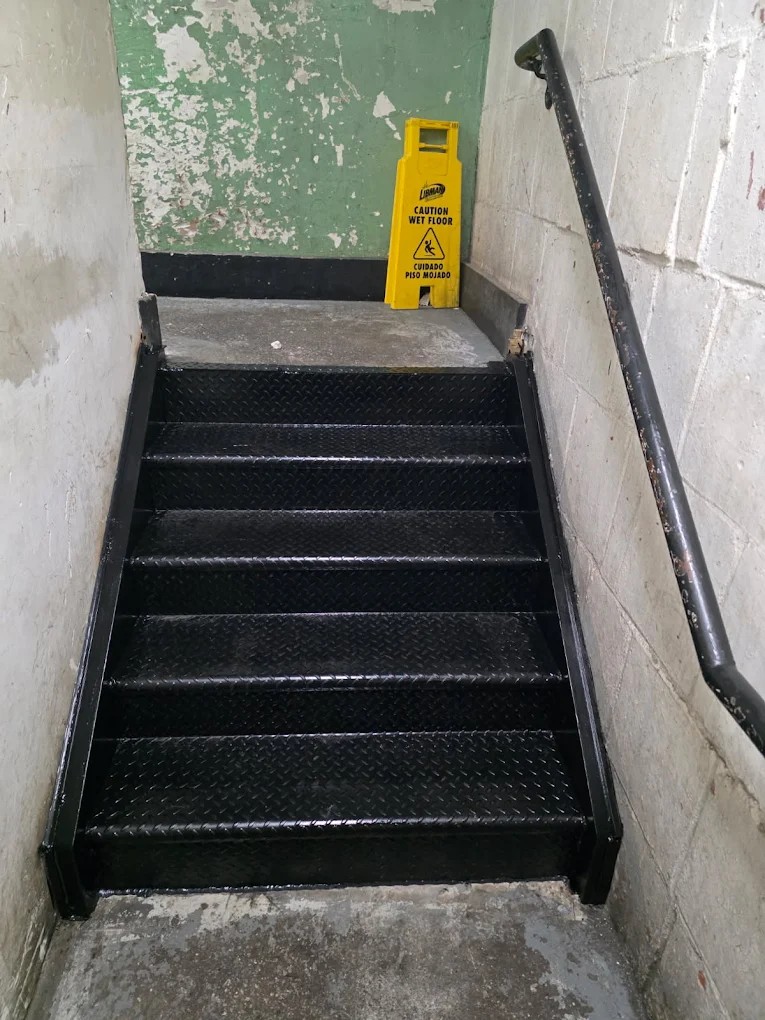 Economaster trash bin enclosure installed by Steel Masters NYC at a Bushwick Brooklyn commercial property